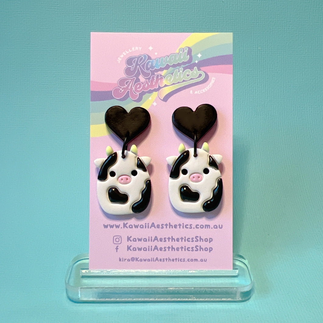 Black and white squish cow polymer clay stud earrings