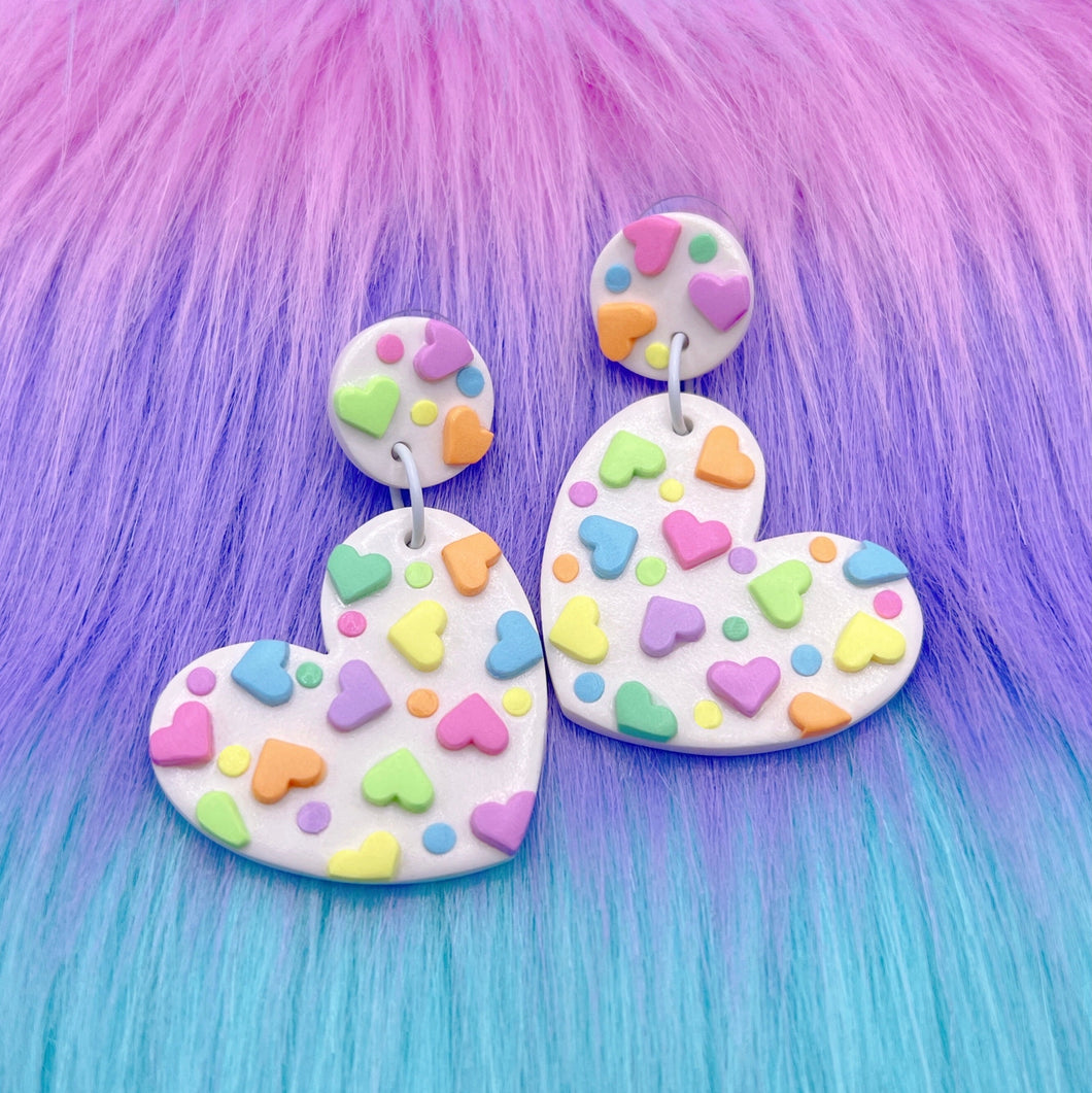 White heart polymer clay stud earrings with rainbow love hearts