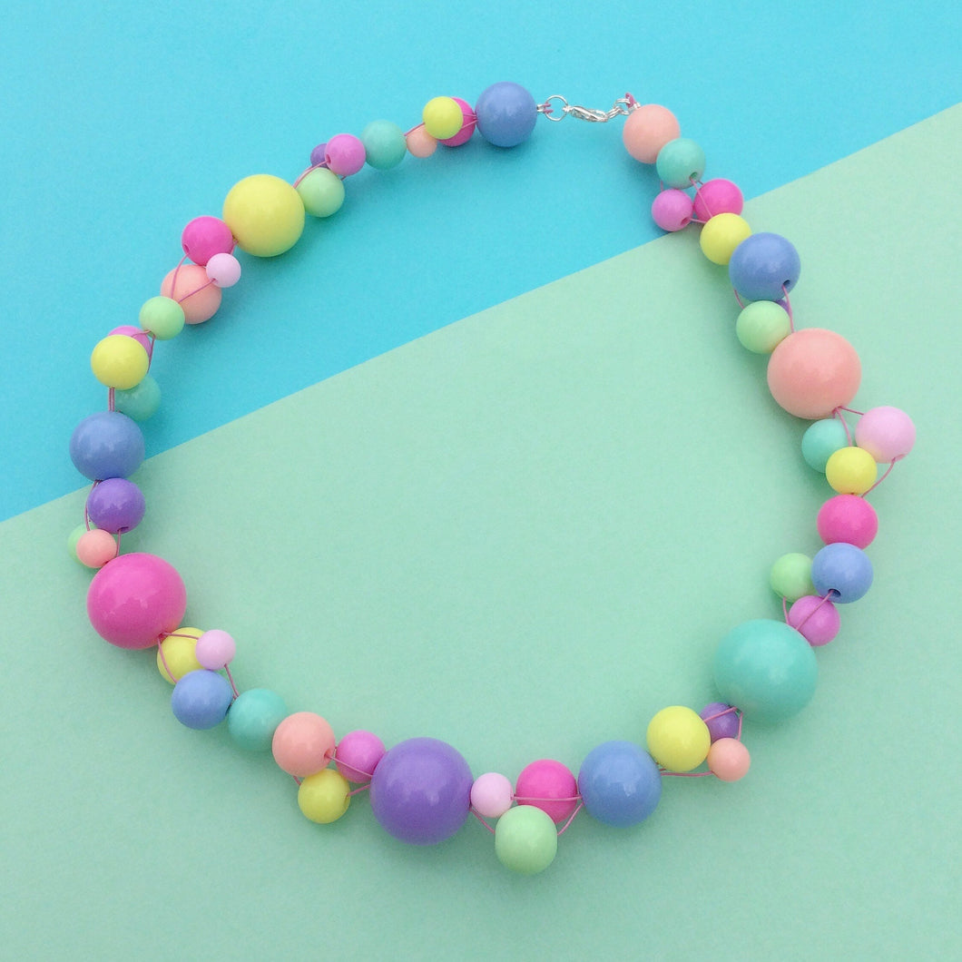 Woven rainbow plastic bead necklace